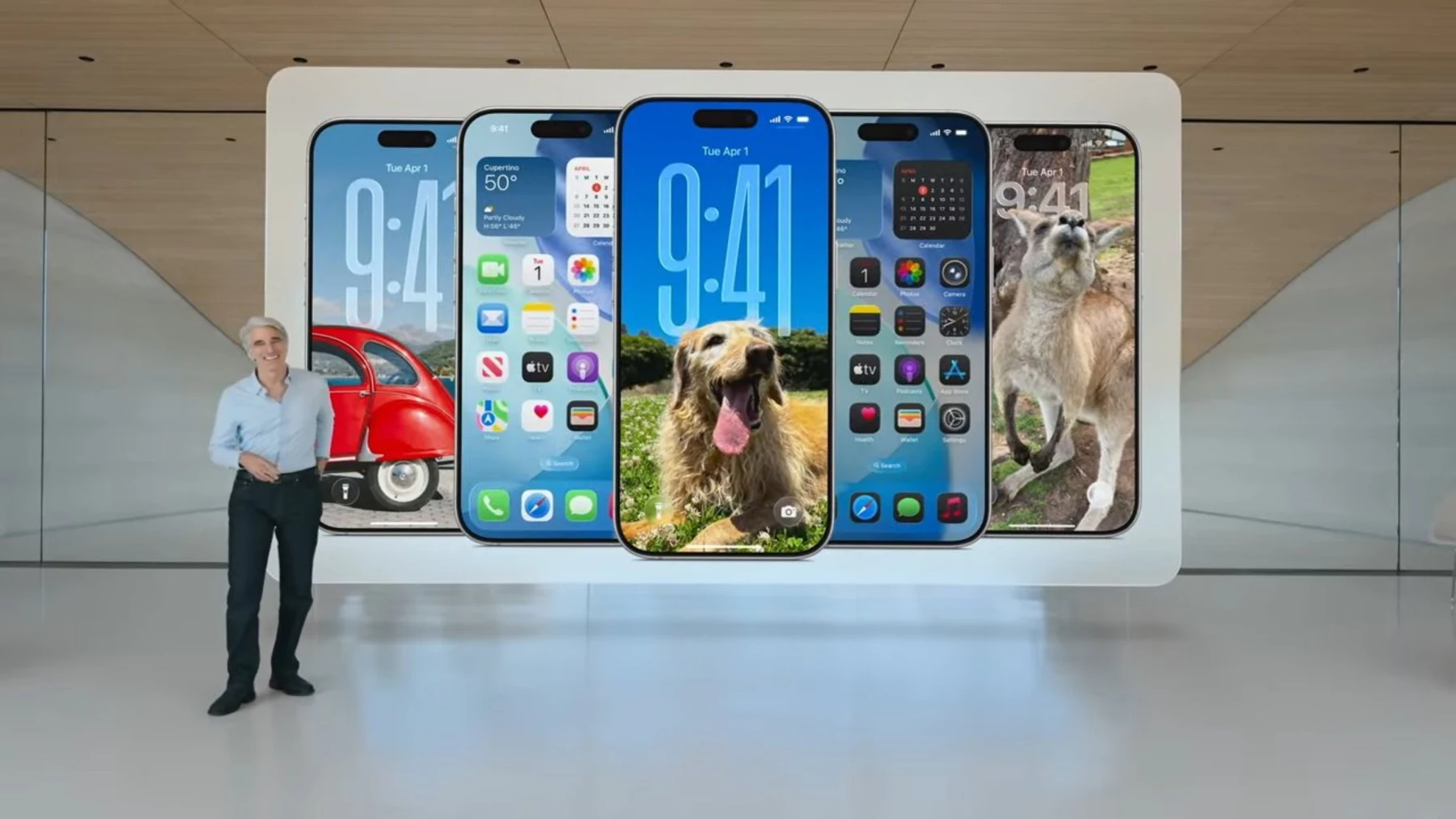 Craig Federighi beside six iPhones showing different iOS interfaces