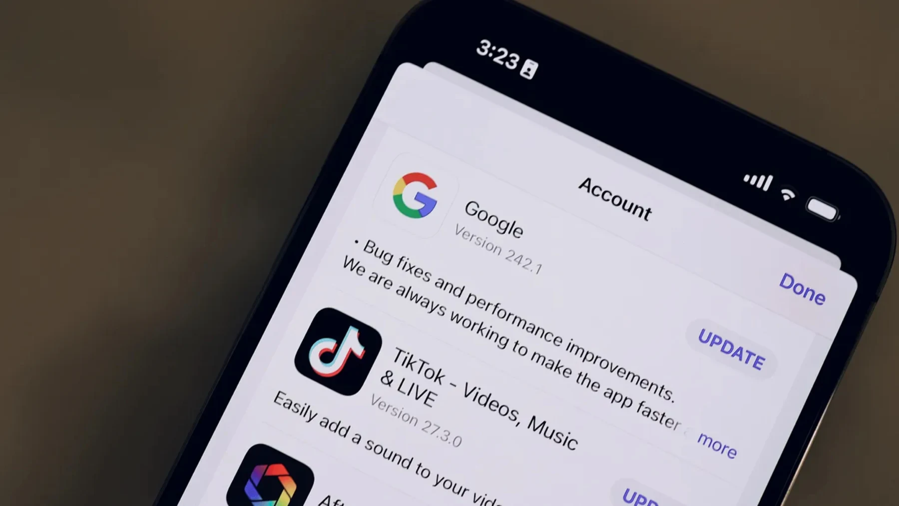 iPhone App Store Updates screen showing third-party apps including Google and TikTok