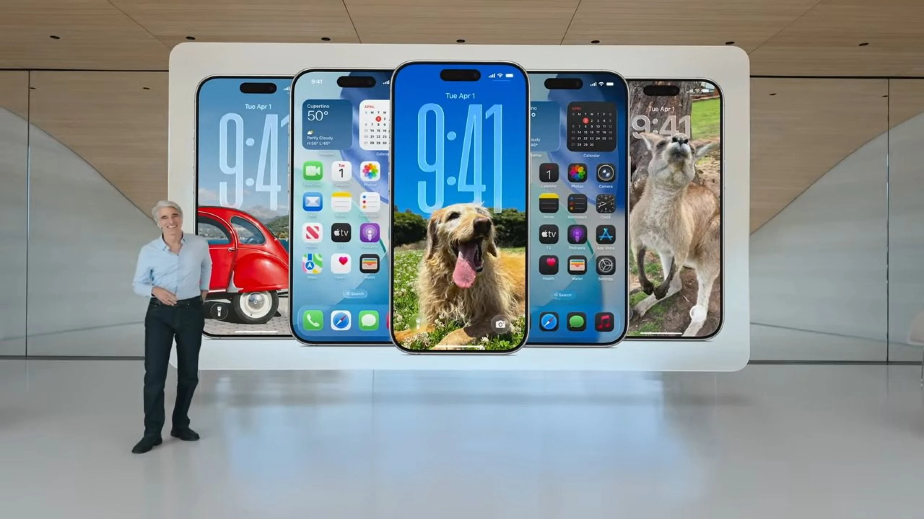 Craig Federighi beside six iPhones showing different iOS interfaces