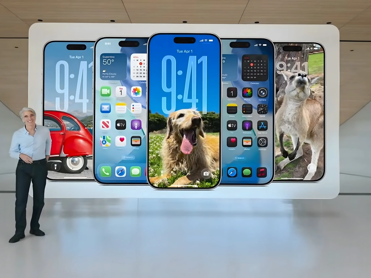 Craig Federighi beside six iPhones showing different iOS interfaces