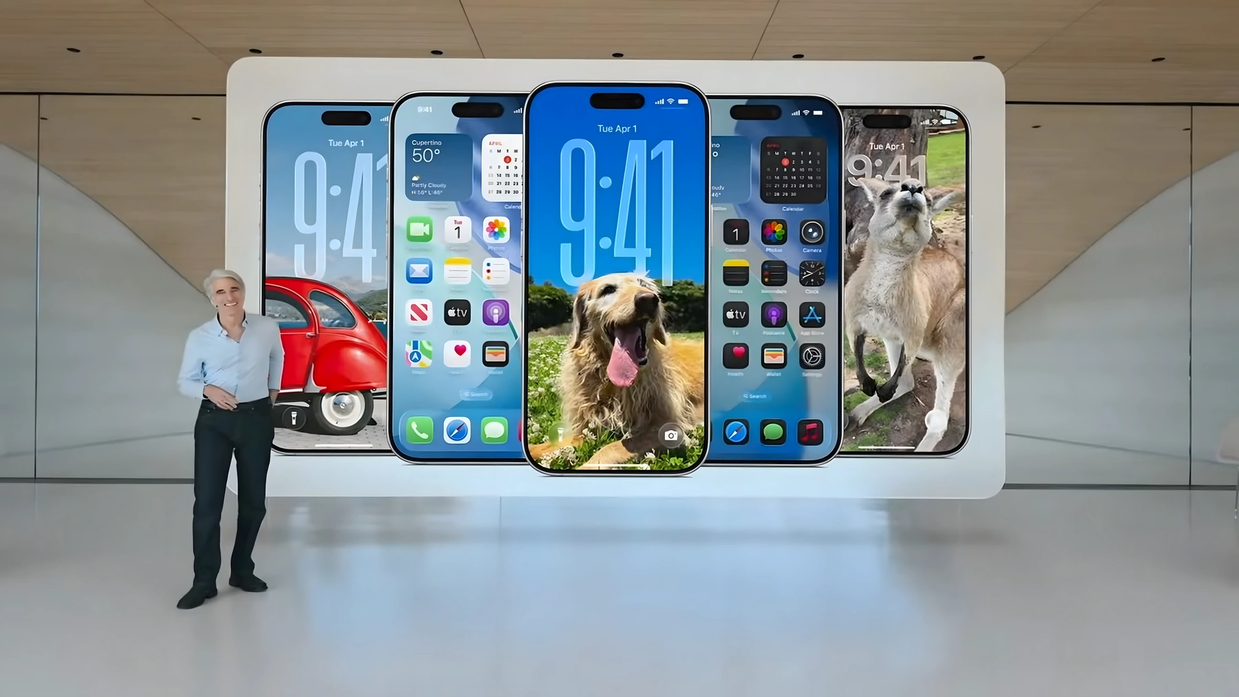 Craig Federighi beside six iPhones showing different iOS interfaces