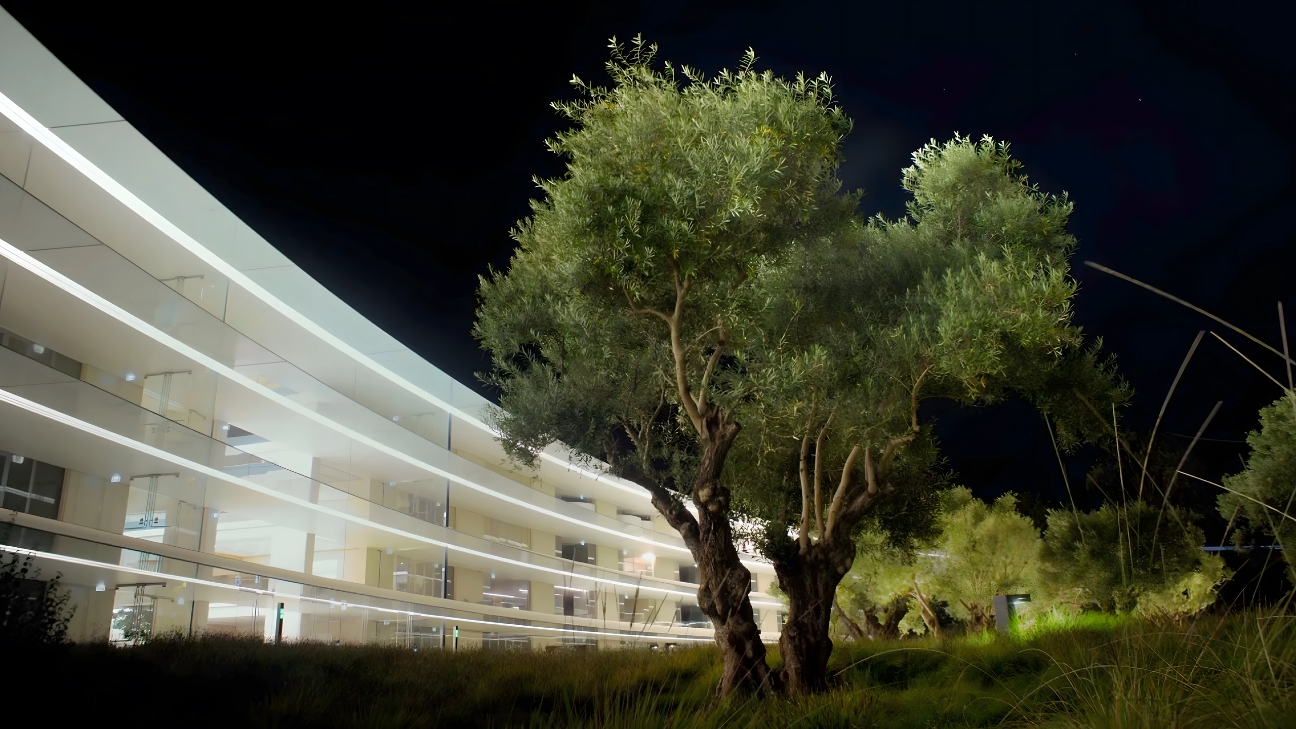 Apple Park courtyard and event stage illuminated at night for the Far Out event