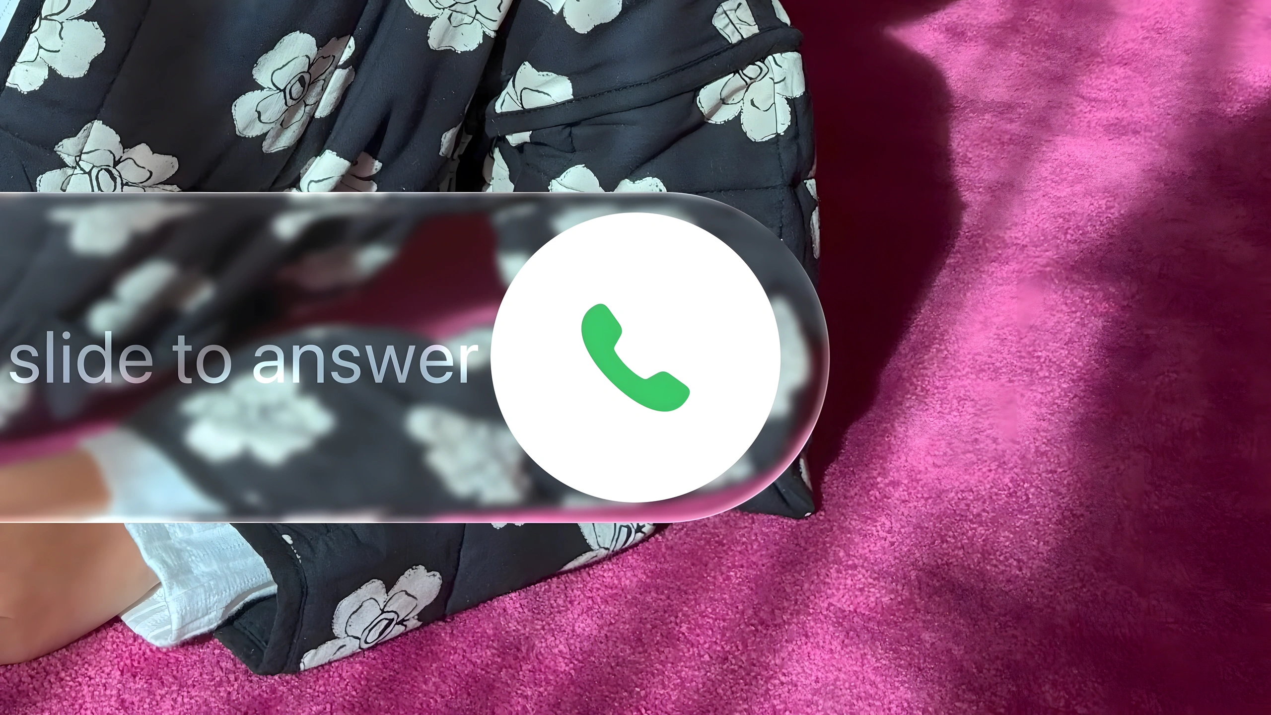 Liquid Glass slide-to-answer control over a patterned iPhone Lock Screen